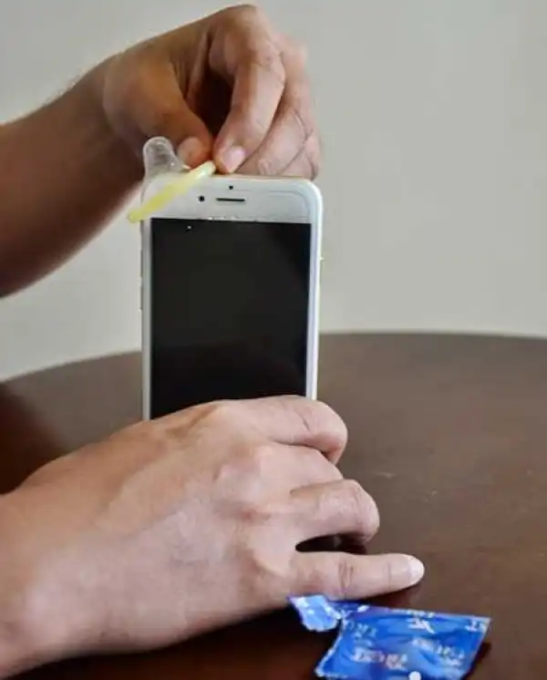 Do You Know That a Condom Can Save Your Phone from Destruction...This Video will Thrill You! (Watch)